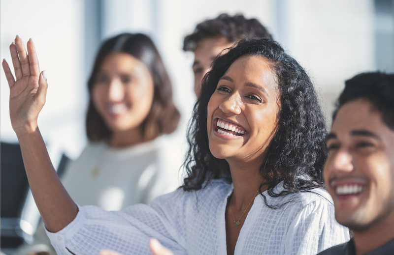 Warm workspace or team shot – real people will read this.